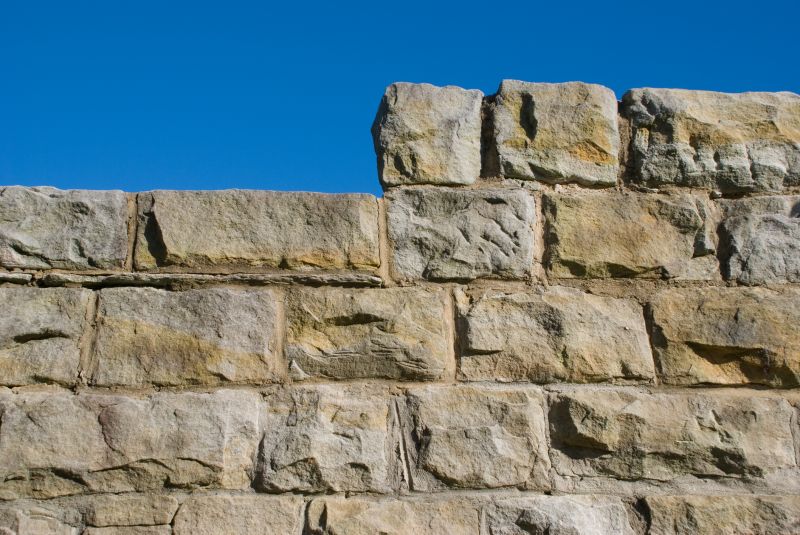 Brick Walls Vs. Stone Walls: Choosing The Right Material